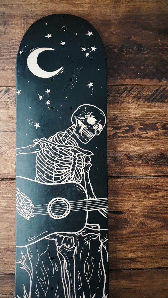 Skeleton Playing Guitar Under the Stars skate deck