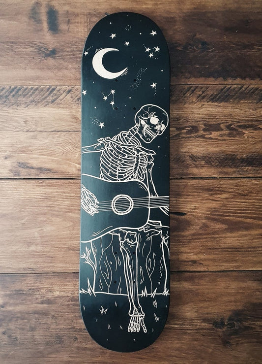 Skeleton Playing Guitar Under the Stars skate deck