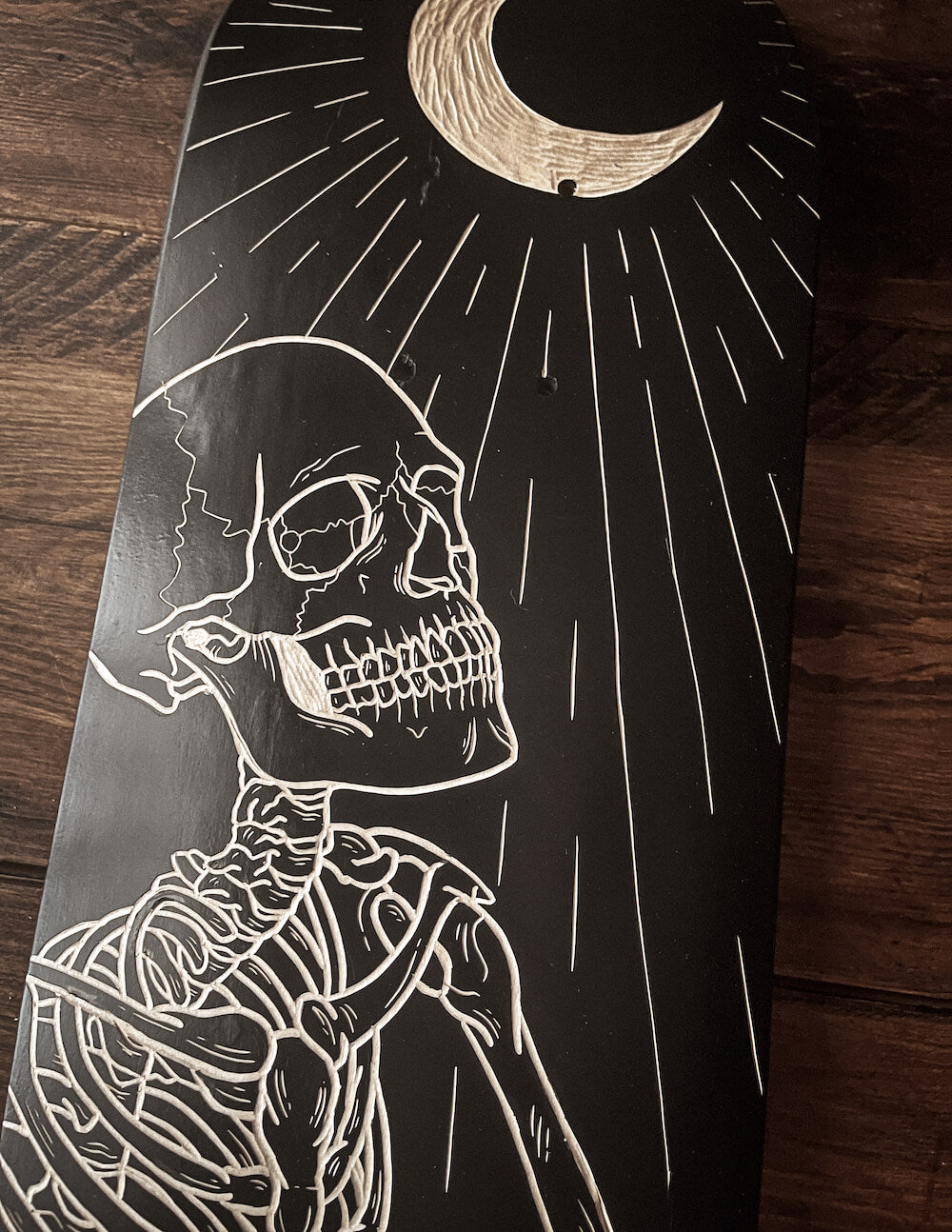 The Skeleton and the Moon Skate Deck